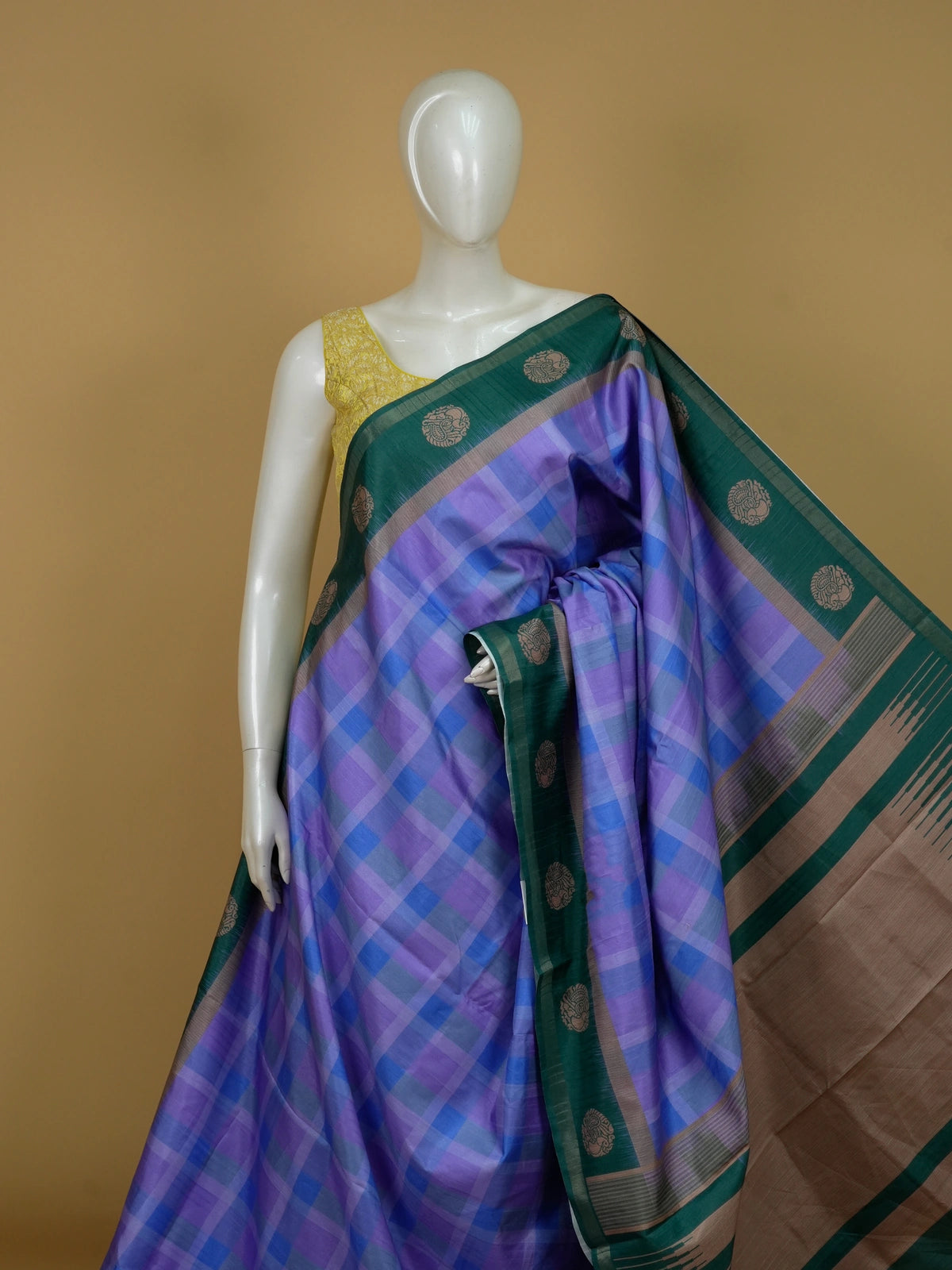 Lavender and blue checked Dola silk saree with green contrast border and copper motifs