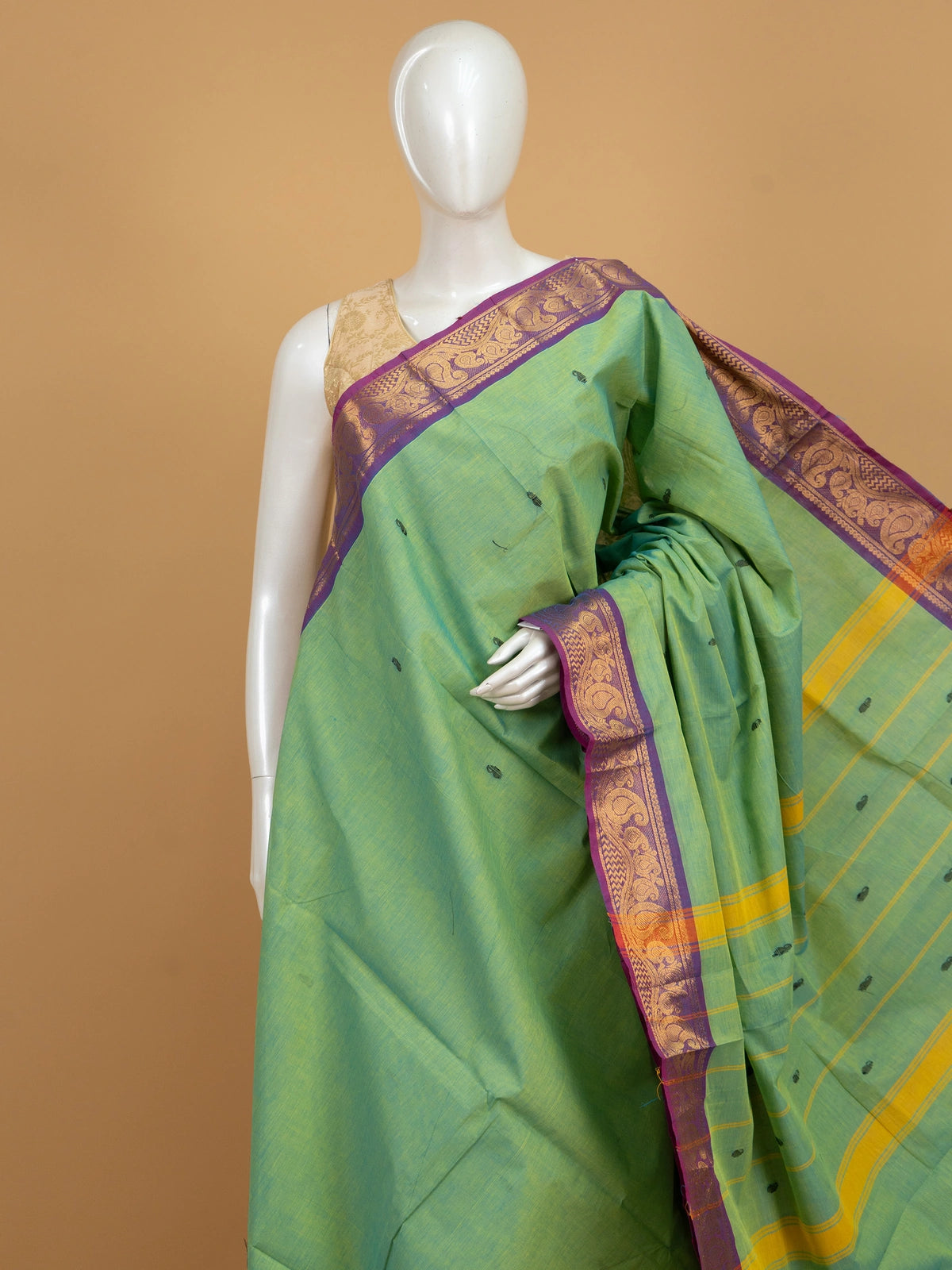 Green Chettinad cotton saree with purple gold zari paisley border and yellow-striped pallu