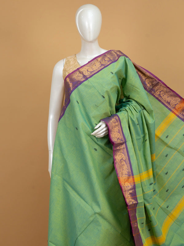 Green Chettinad cotton saree with purple gold zari paisley border and yellow-striped pallu