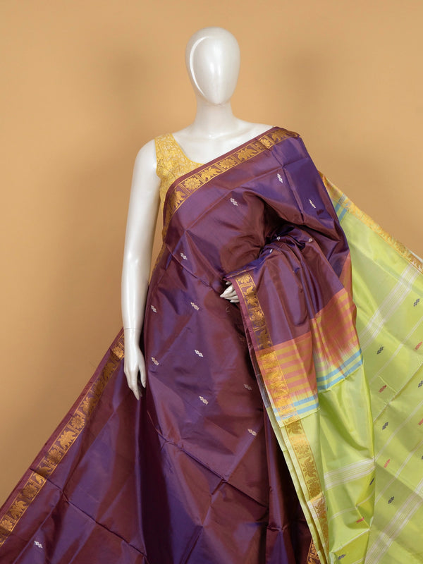 Purple banana silk saree with gold zari lotus border and contrast lime green pallu