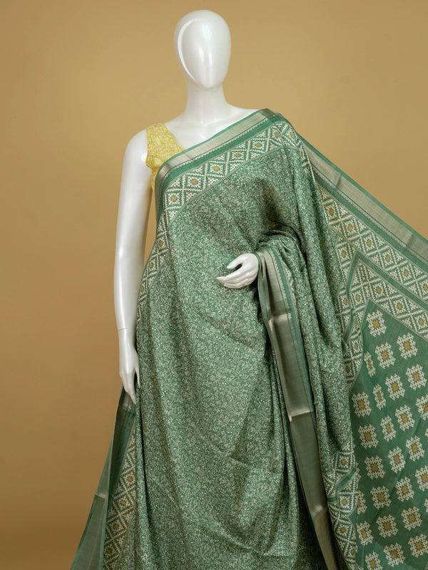 Sea green designer saree with cream tribal Warli print and gold zari border