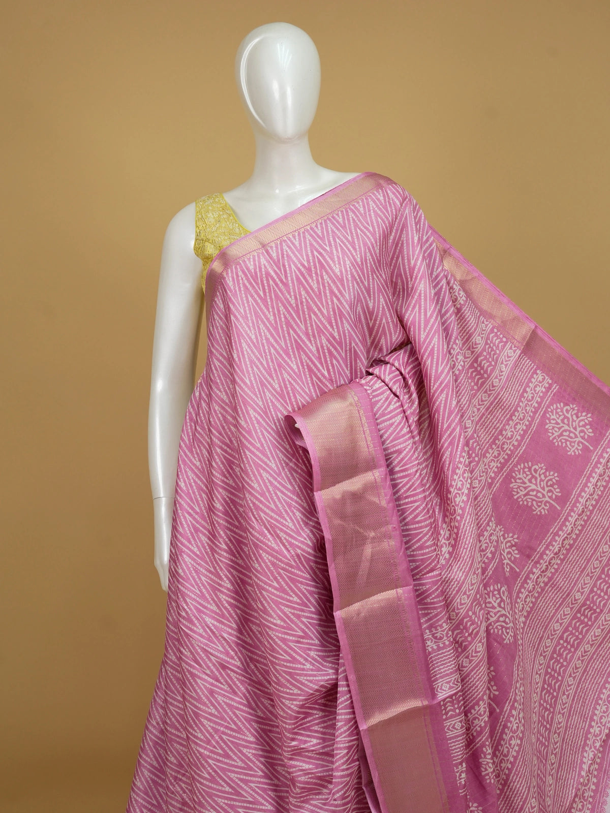 Pink and white chevron printed designer saree with gold zari border and tree-of-life pallu
