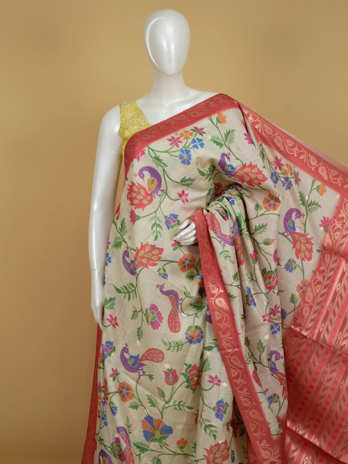 Cream linen cotton saree with multicolour peacock floral weave and red zari border