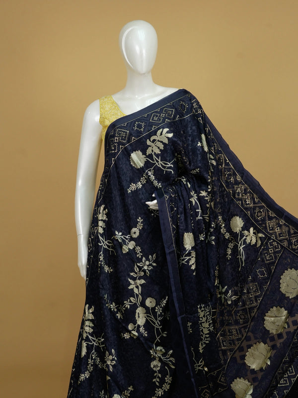 Navy blue designer saree with gold floral print, lotus pallu motifs and patola geometric border