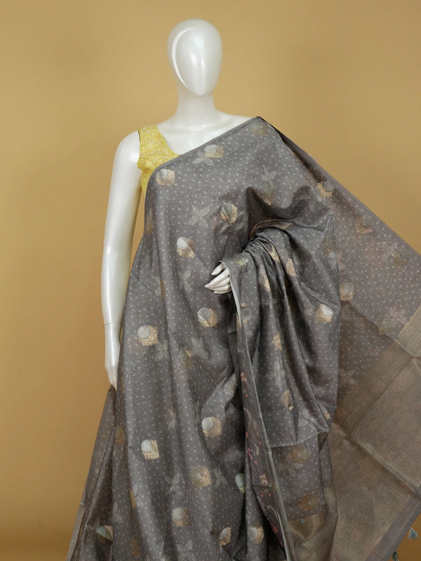 Grey designer saree with gold and silver woven floral buttas and a golden zari tissue border