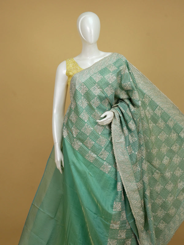 Sea green designer organza saree with silver zari and sequin paisley embroidery and embellished border