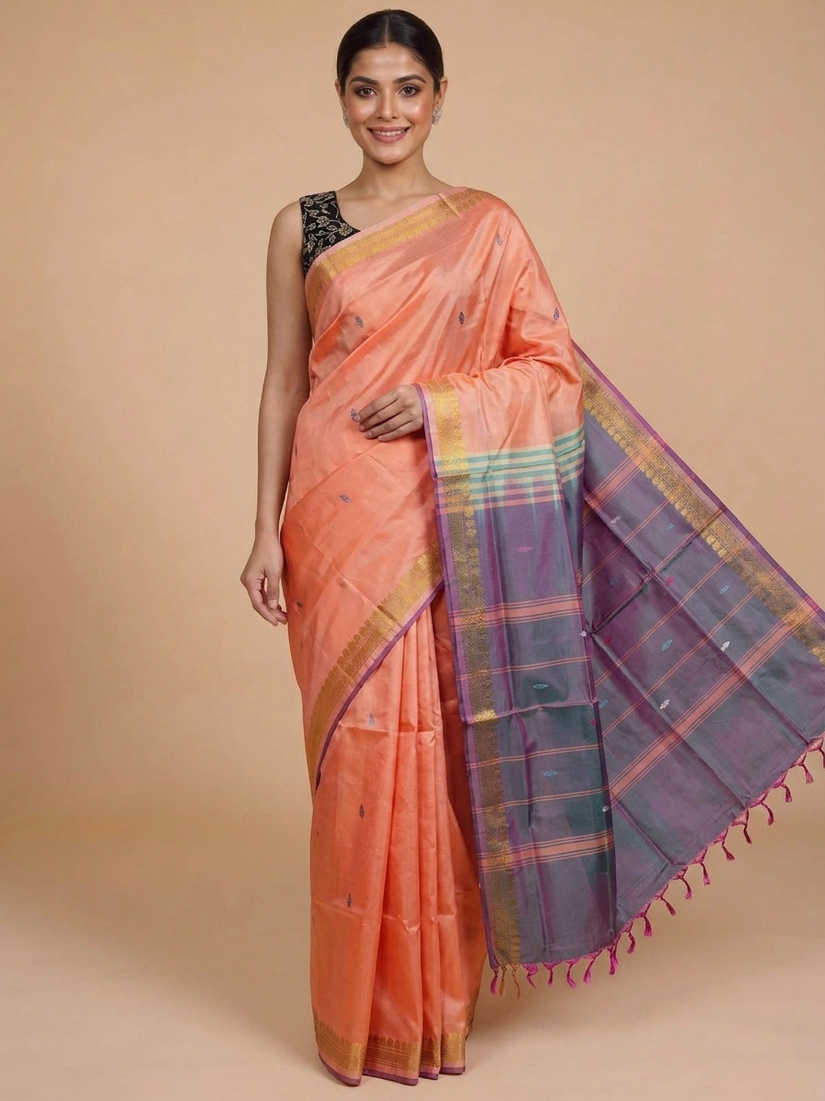 Peach Banana Silk saree with gold zari border, contrast grey checked pallu and embroidered black blouse