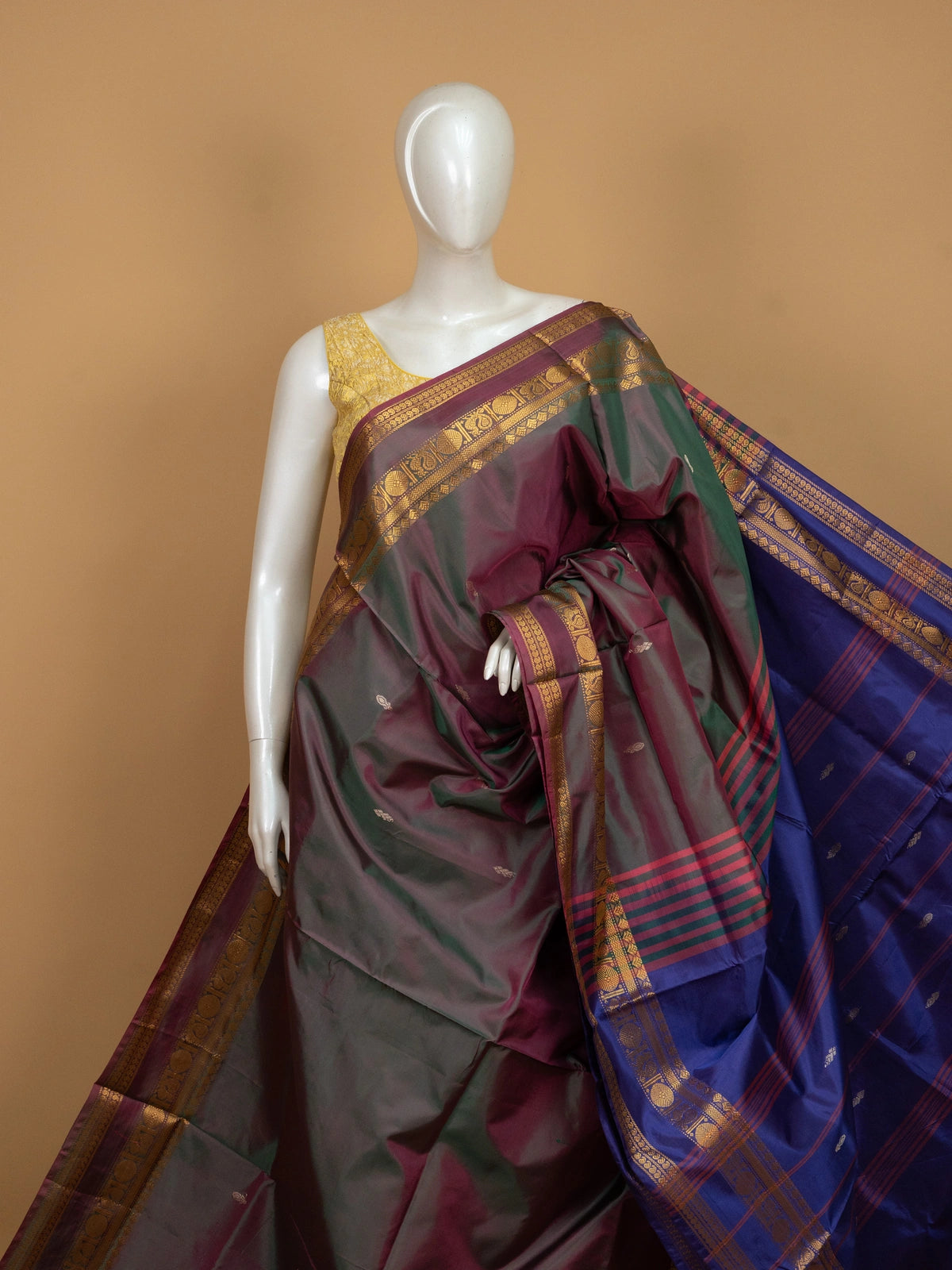 Maroon green banana silk saree with gold zari border and contrast royal blue pallu