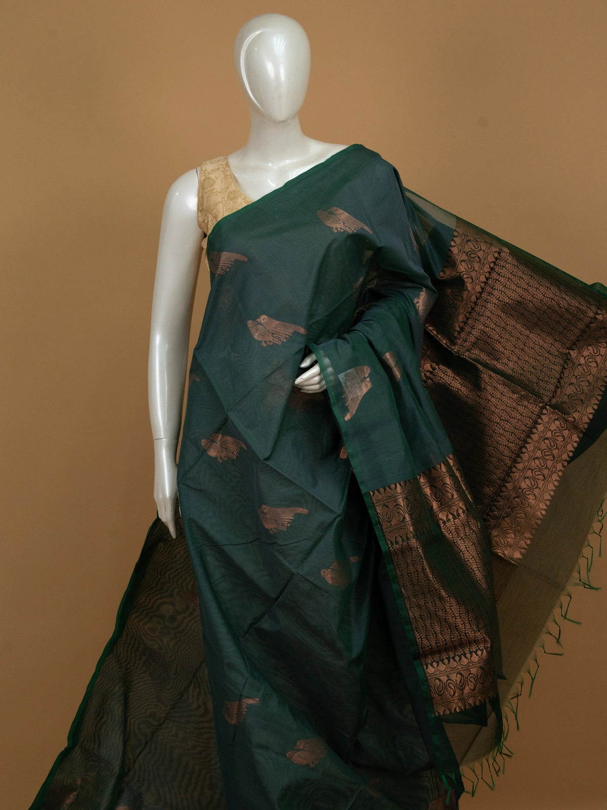 Bottle green silk cotton saree with copper zari bird motifs and contrast zari border
