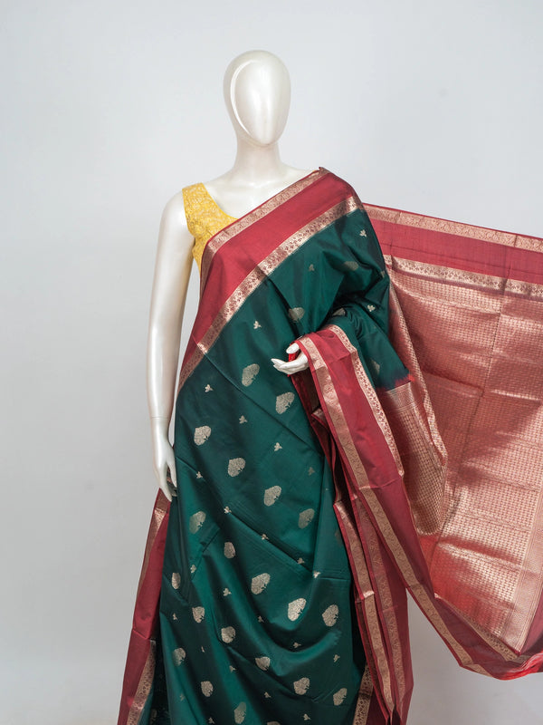 Bottle green semi silk saree with contrast maroon gold zari border and buttas
