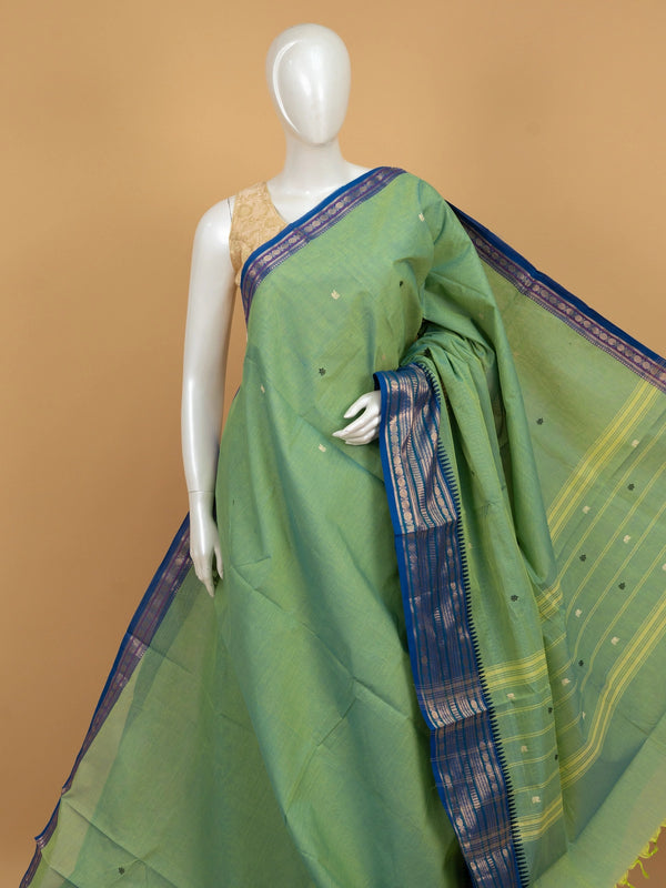 Green Chettinad cotton saree with contrast blue and gold zari temple border and scattered buttas