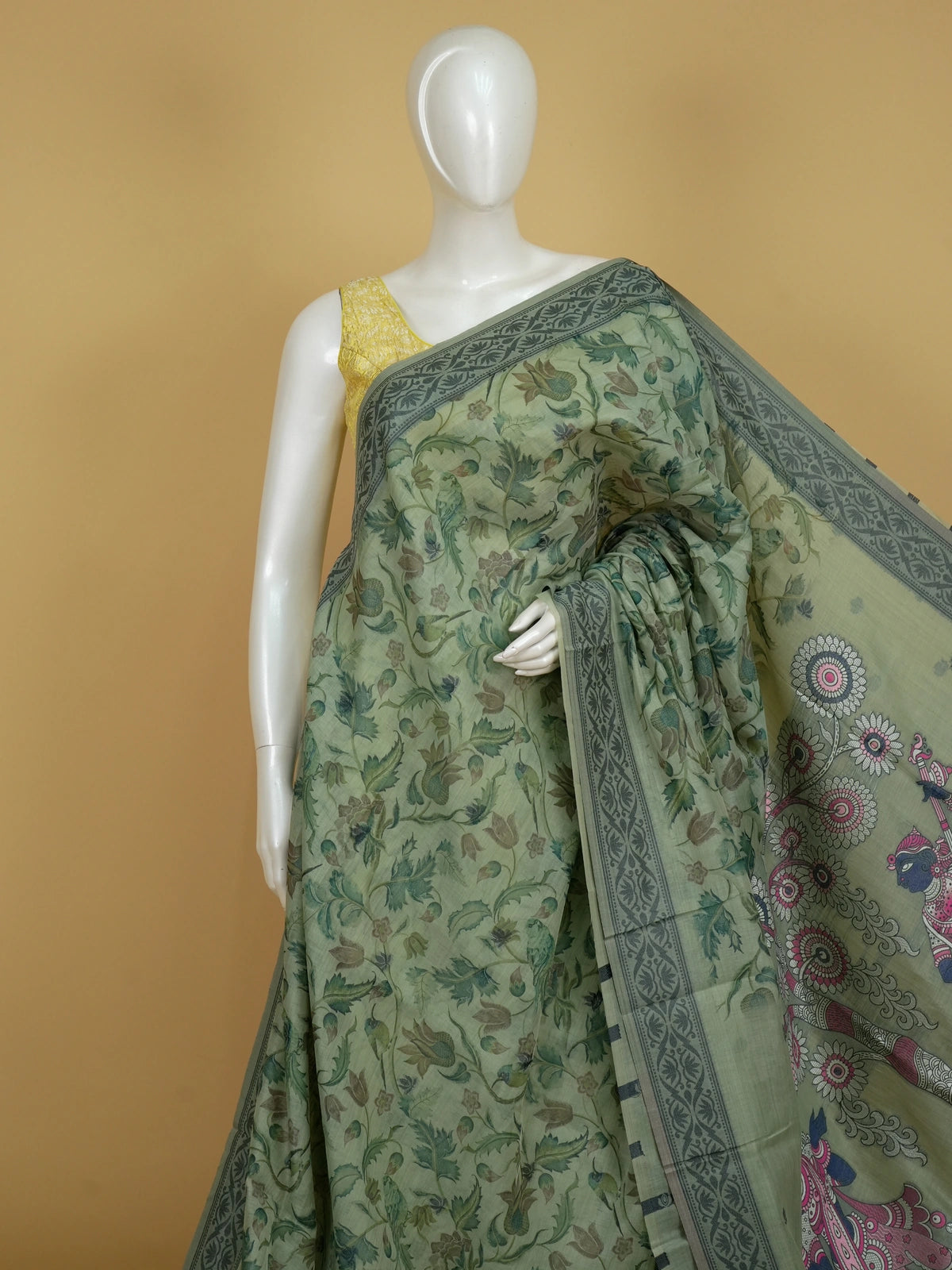Sage green linen cotton saree with floral and bird print, grey floral border and Pattachitra-style pallu