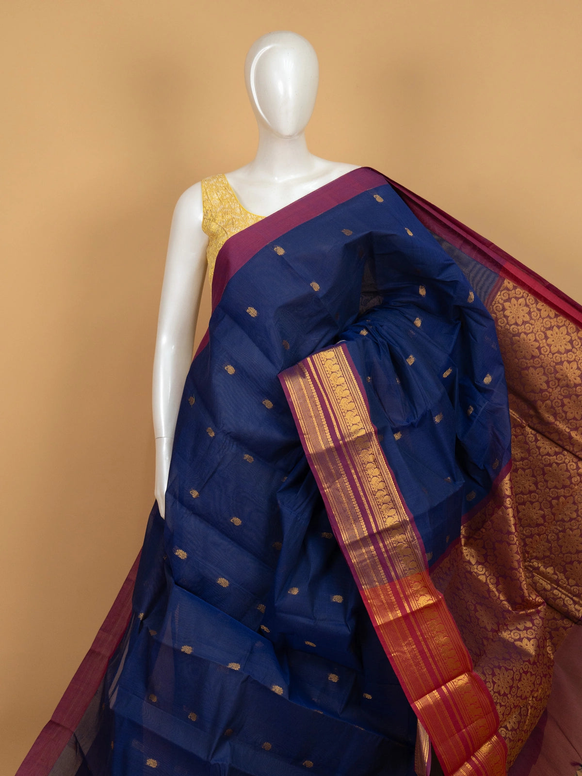 Navy blue Chettinad cotton saree with magenta gold zari border and yellow contrast blouse