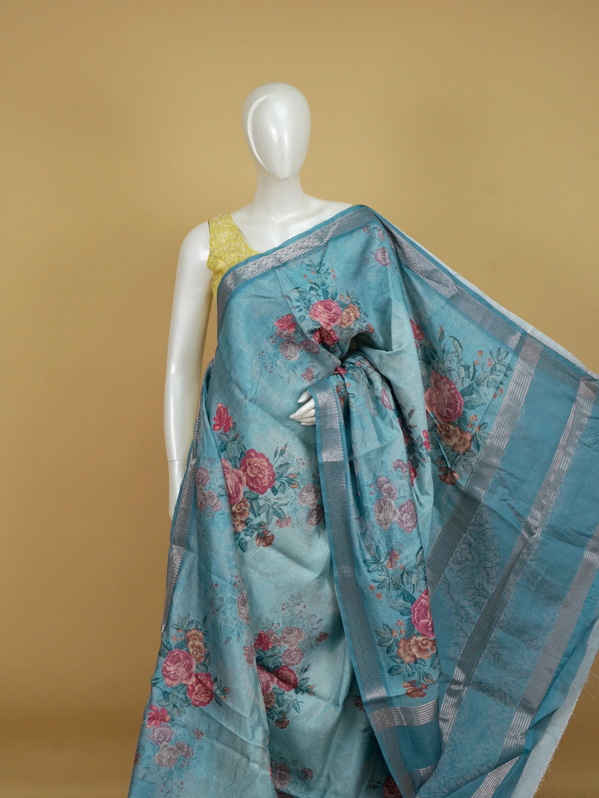 Sky blue semi tussar saree with pink rose floral print and silver zari border