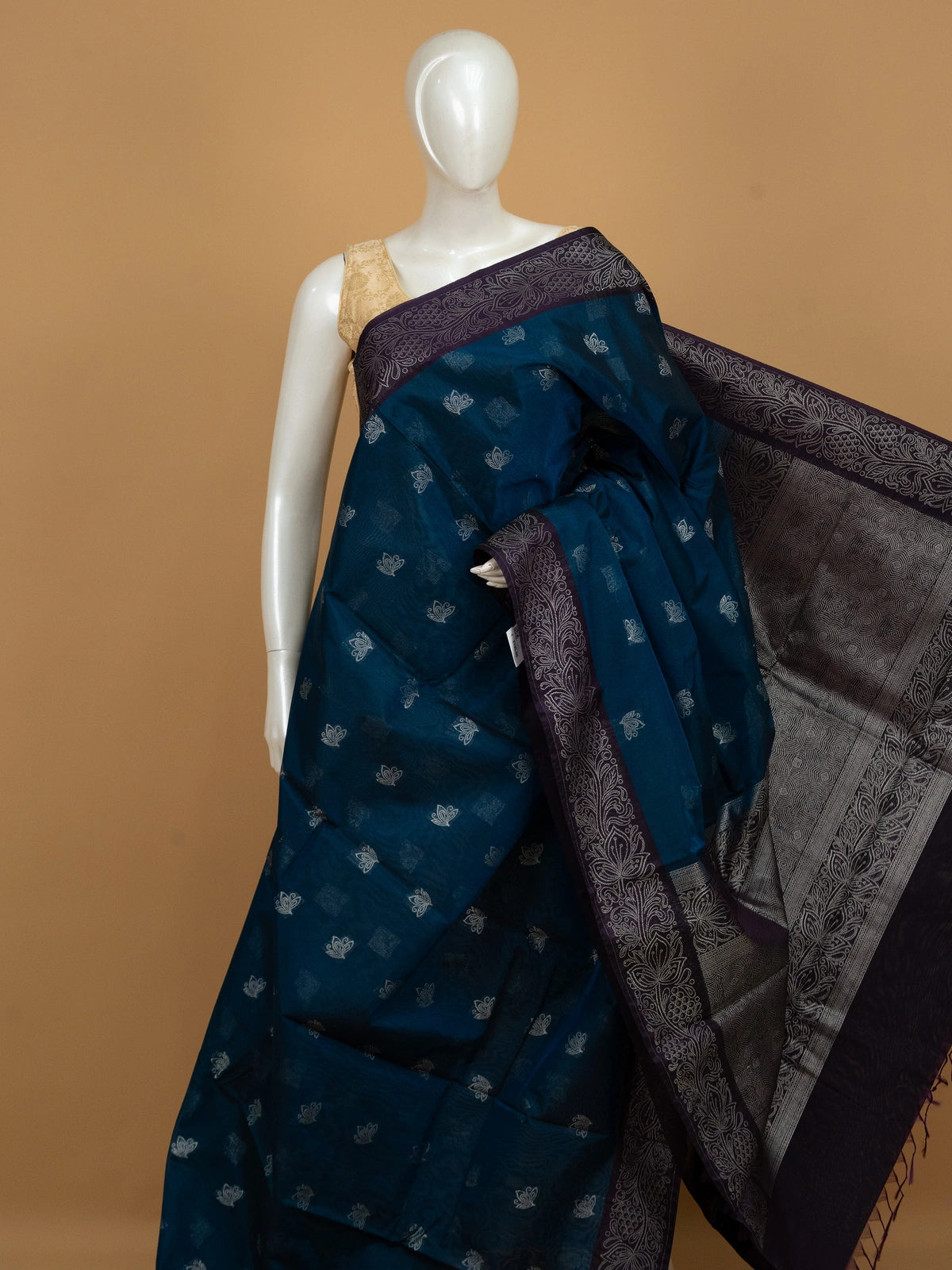 Peacock blue silk cotton saree with silver lotus buttas and contrast purple silver-woven border