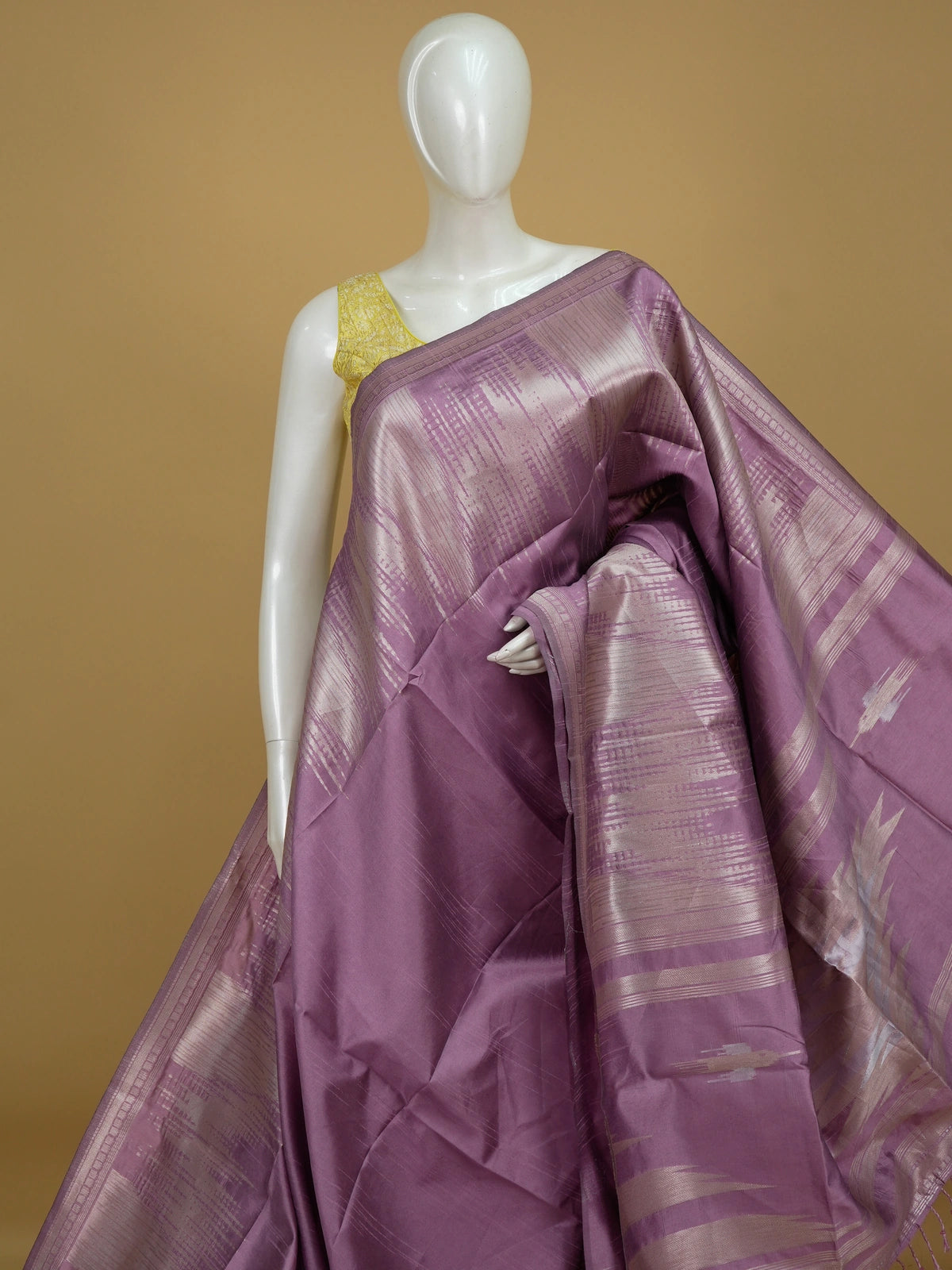 Mauve semi tussar saree with silver zari streaks and temple motif border