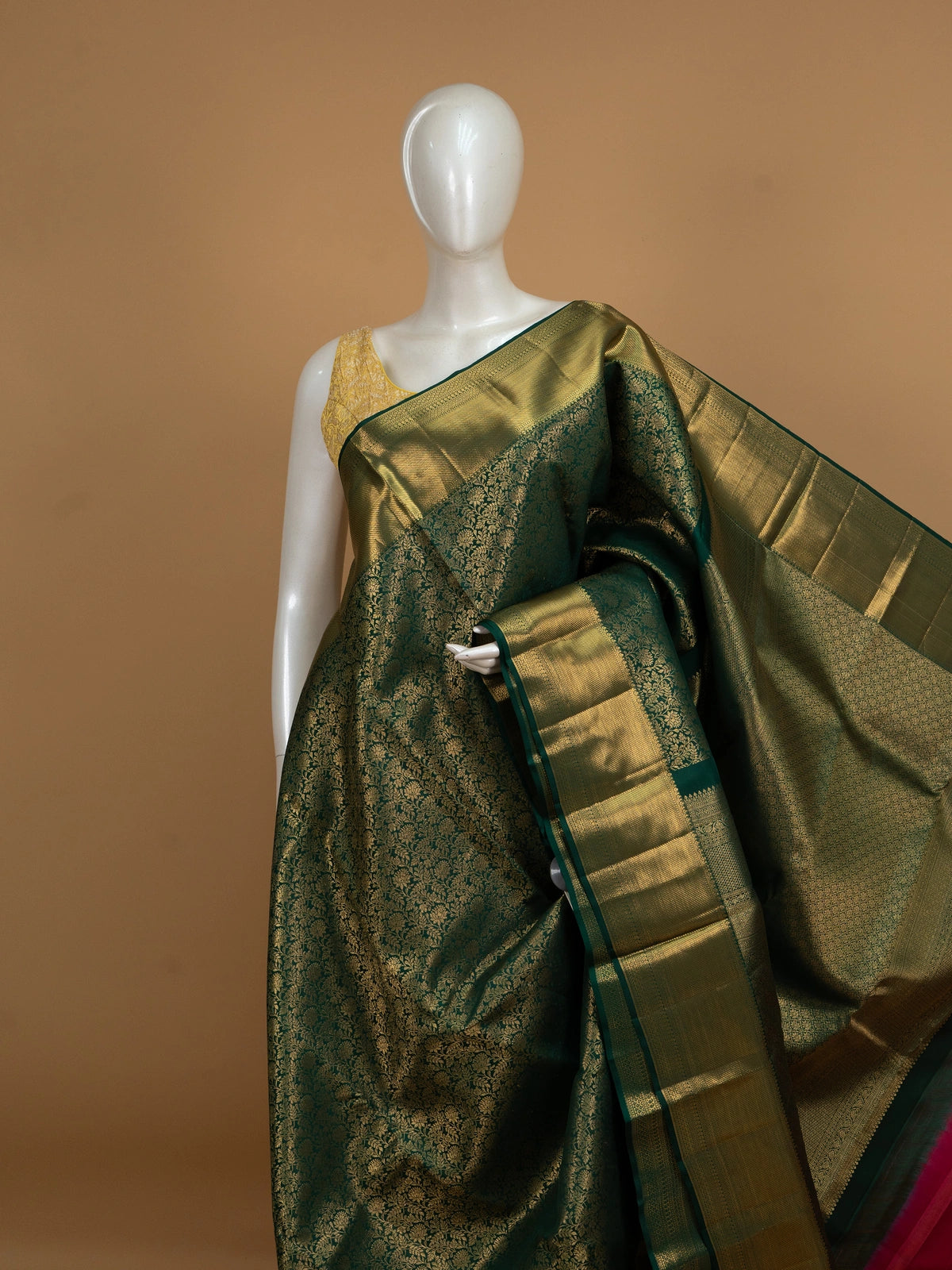 Deep green pure Kanchipuram silk saree with allover gold zari floral brocade and contrast gold zari border