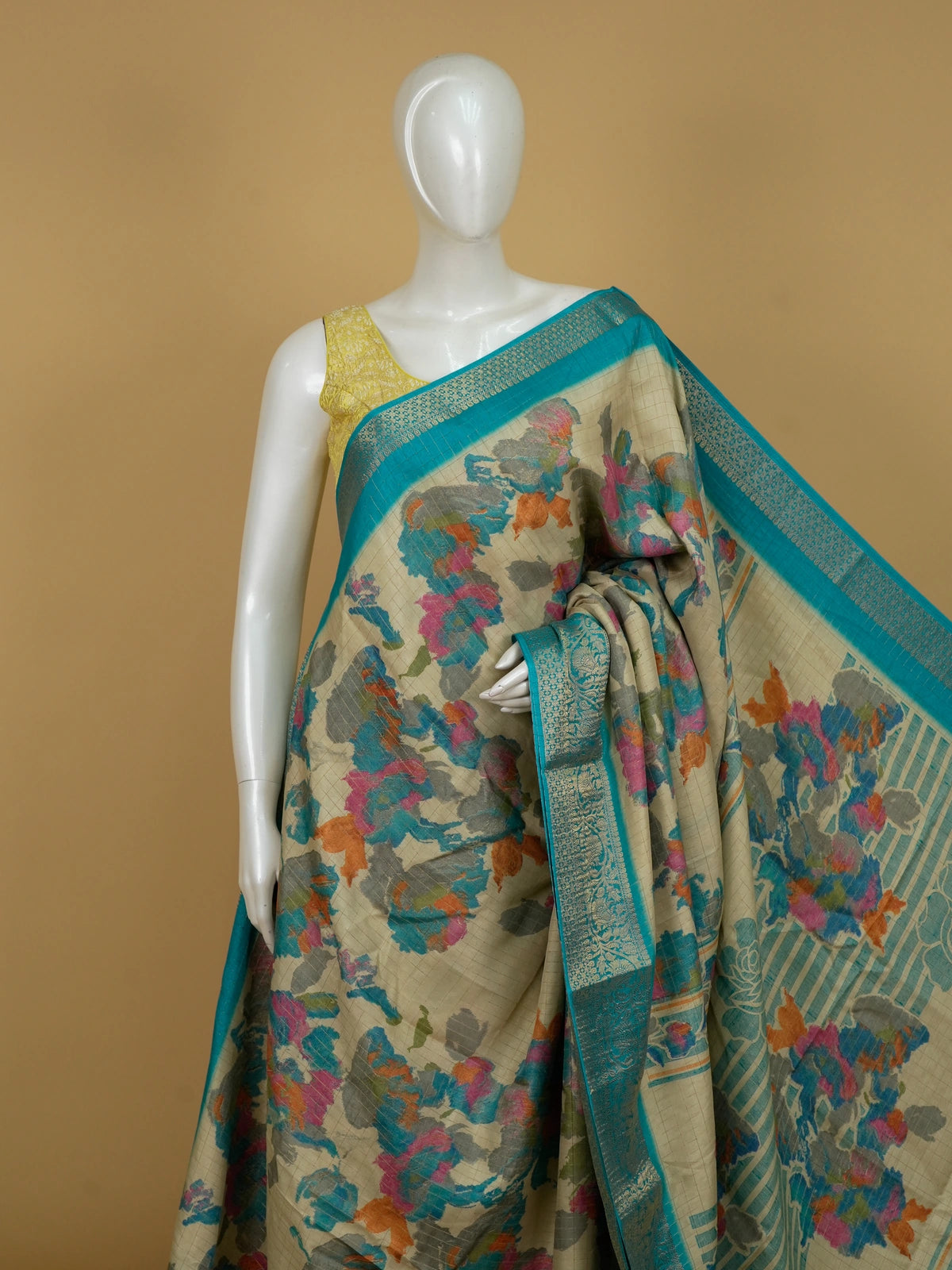 Cream Dola silk saree with multicolour floral print and turquoise zari border