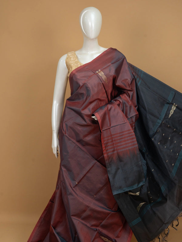 Maroon and charcoal grey banana silk saree with gold zari buttas and peacock and elephant motif pallu