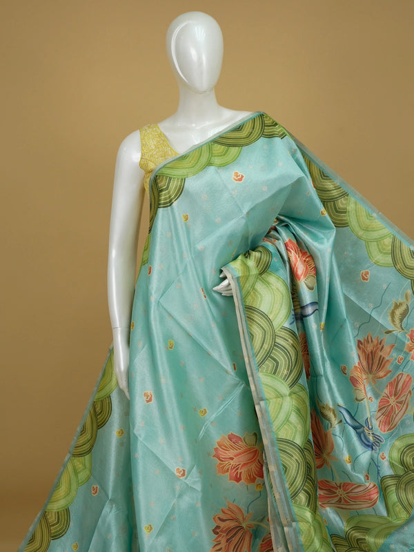 Turquoise semi tussar saree with green scalloped border and Kalamkari-style lotus and crane printed pallu