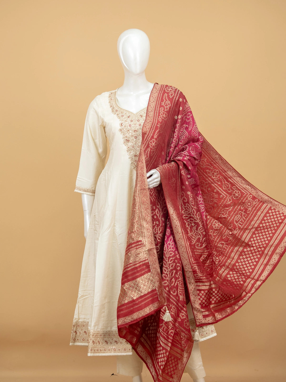 Cream zari embroidered anarkali kurti set with maroon bandhani dupatta and cream straight pants