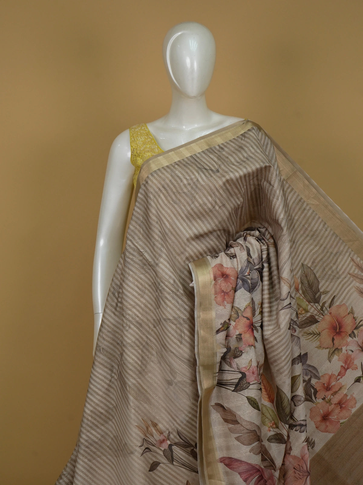 Beige linen cotton saree with tropical floral hummingbird print and gold zari border
