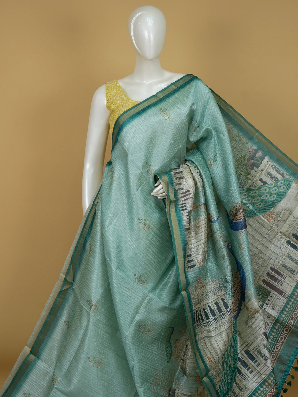 Sea green semi tussar saree with teal zari border and peacock palace printed pallu