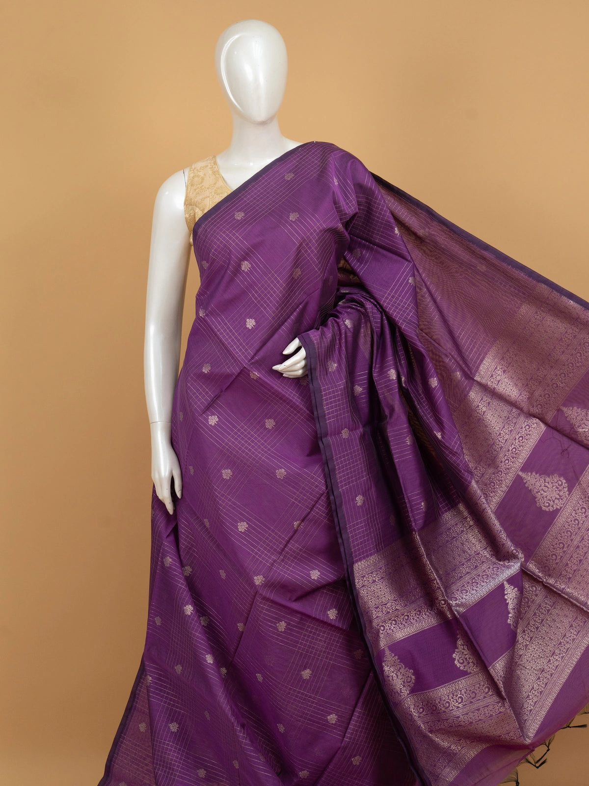 Purple silk cotton saree with silver zari checks, floral buttas and ornate woven border