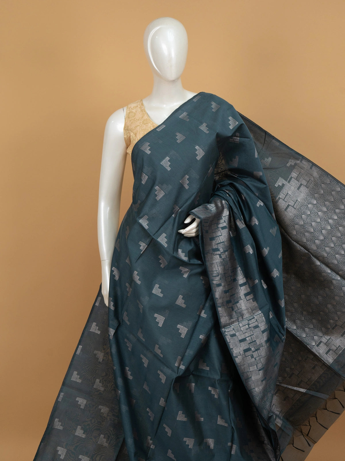 Teal blue silk cotton saree with silver zari geometric motifs and patterned pallu