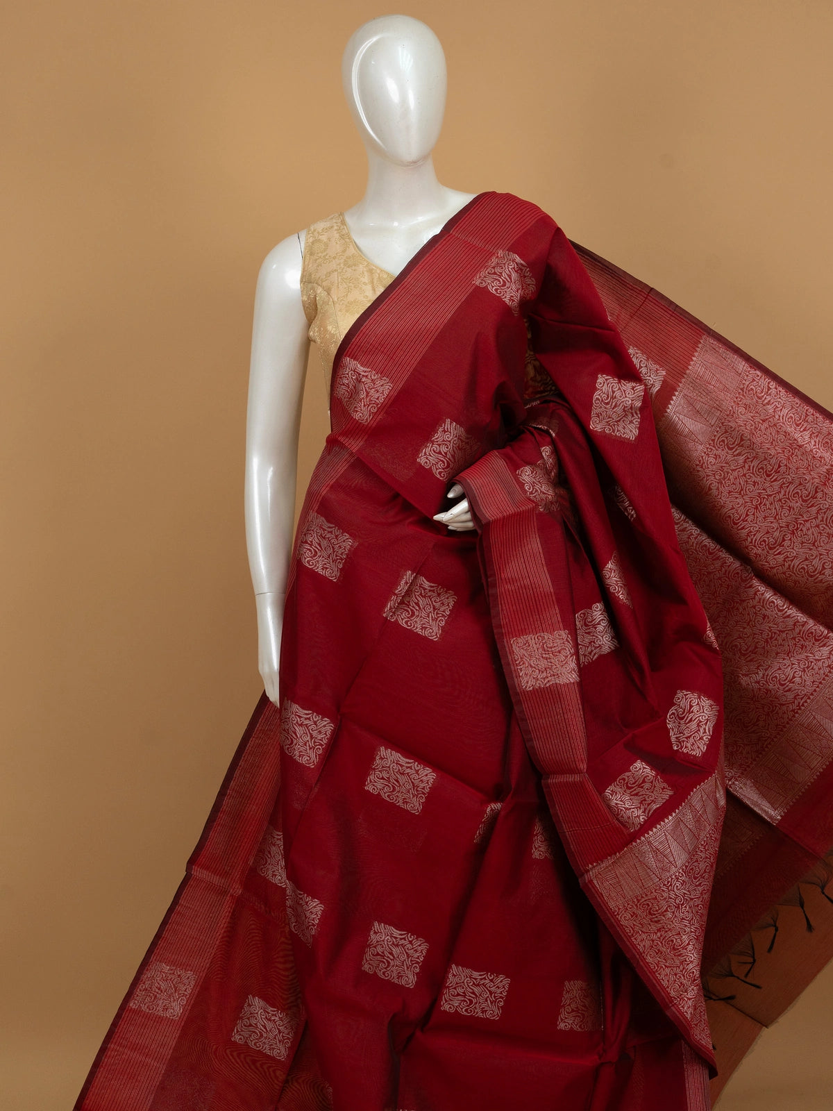 Maroon silk cotton saree with silver zari square buttas and woven pallu
