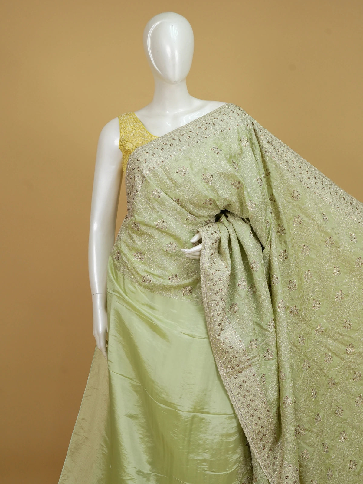 Pista green designer saree with sequin floral embroidery and contrast yellow blouse
