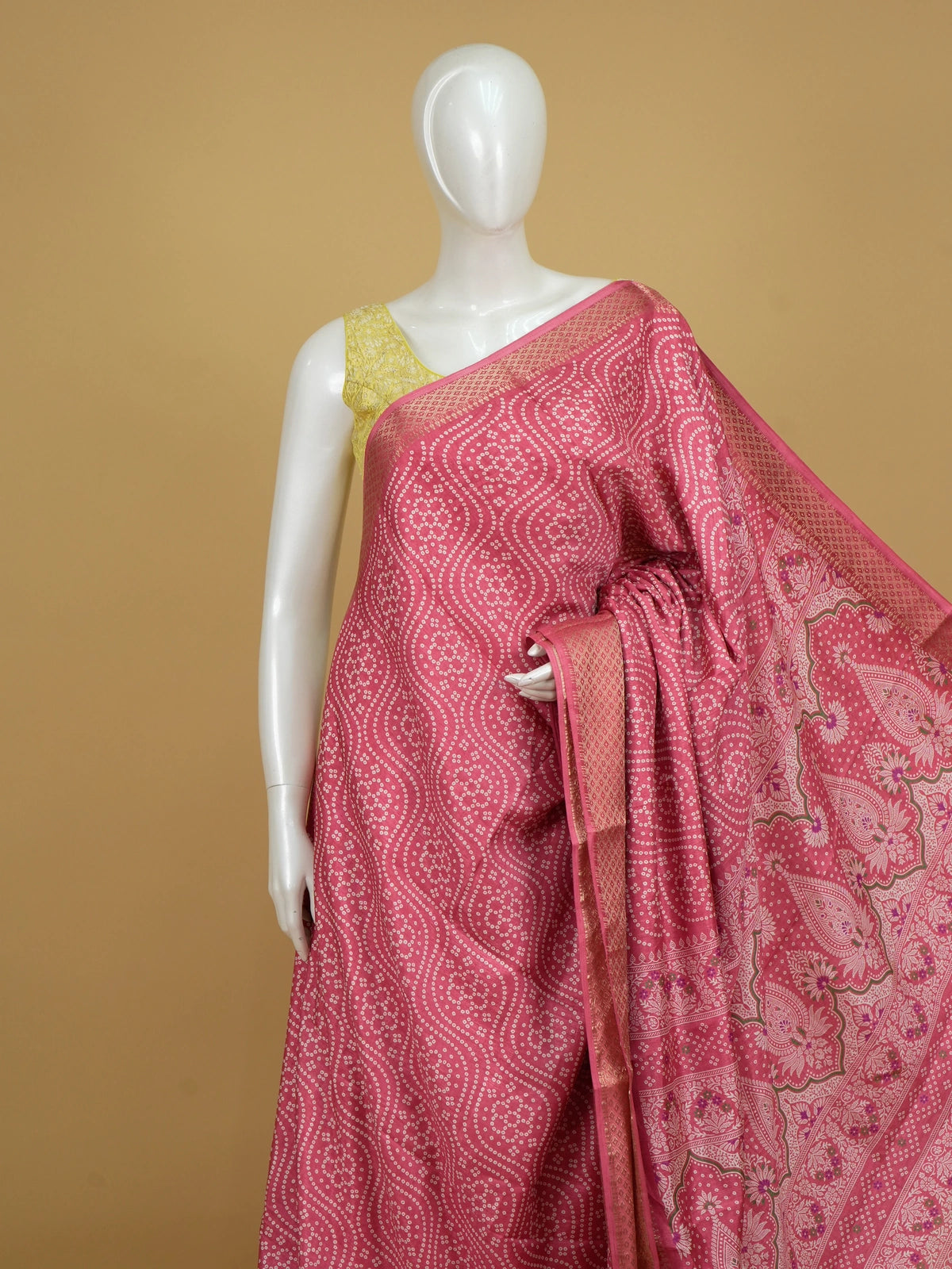 Pink bandhani-print Dola silk saree with gold zari border and floral paisley pallu