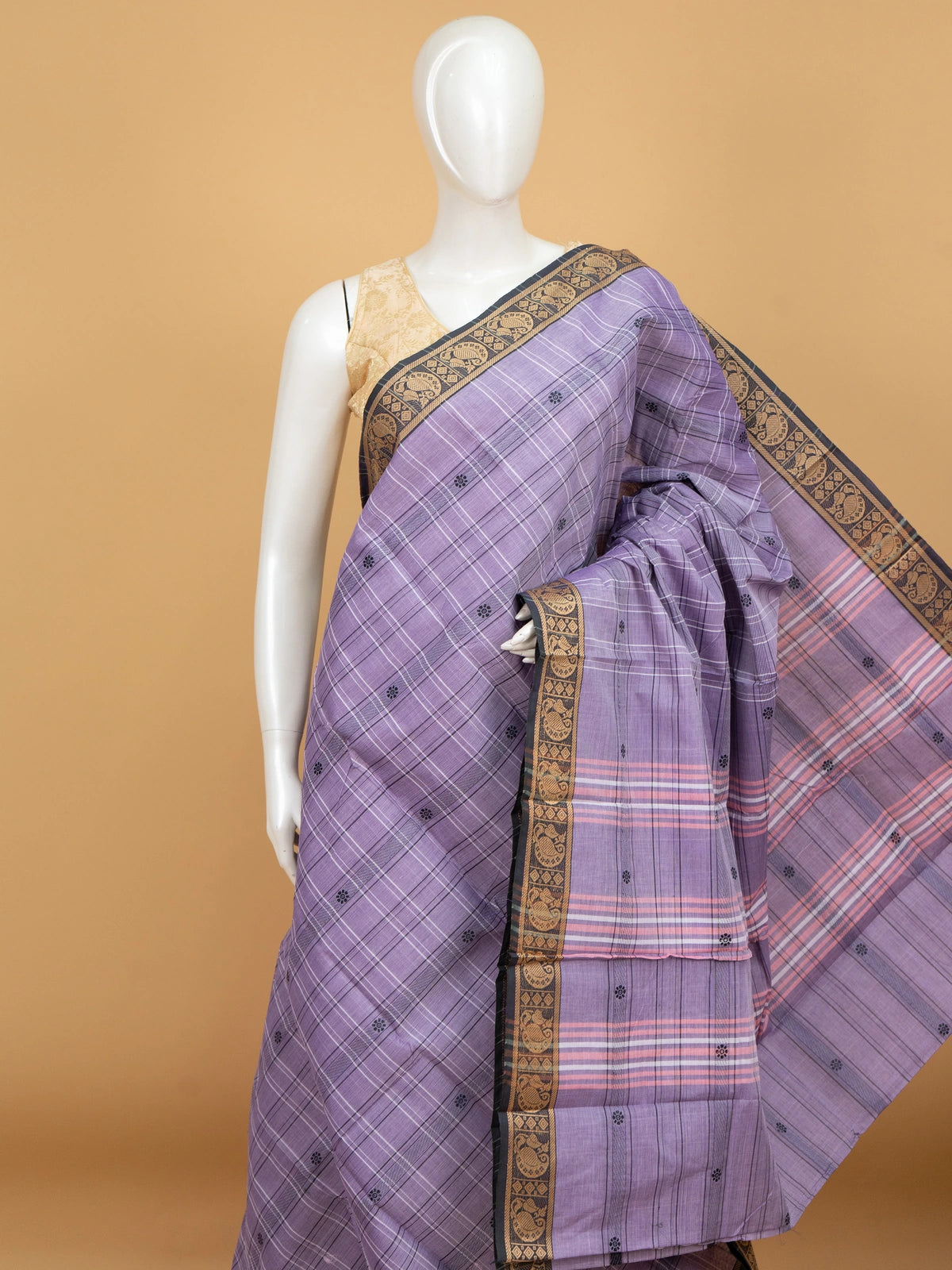 Lavender Chettinad cotton saree with black and gold zari peacock border and pink striped pallu