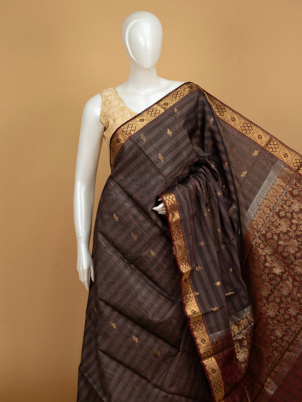 Coffee brown pure silk cotton saree with striped body, gold zari buttas, maroon contrast border and floral zari pallu