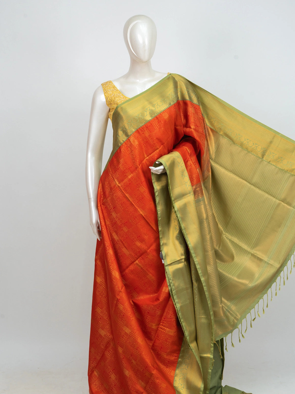 Orange Kanchipuram Fancy Silk saree with contrast green and gold zari border and pallu