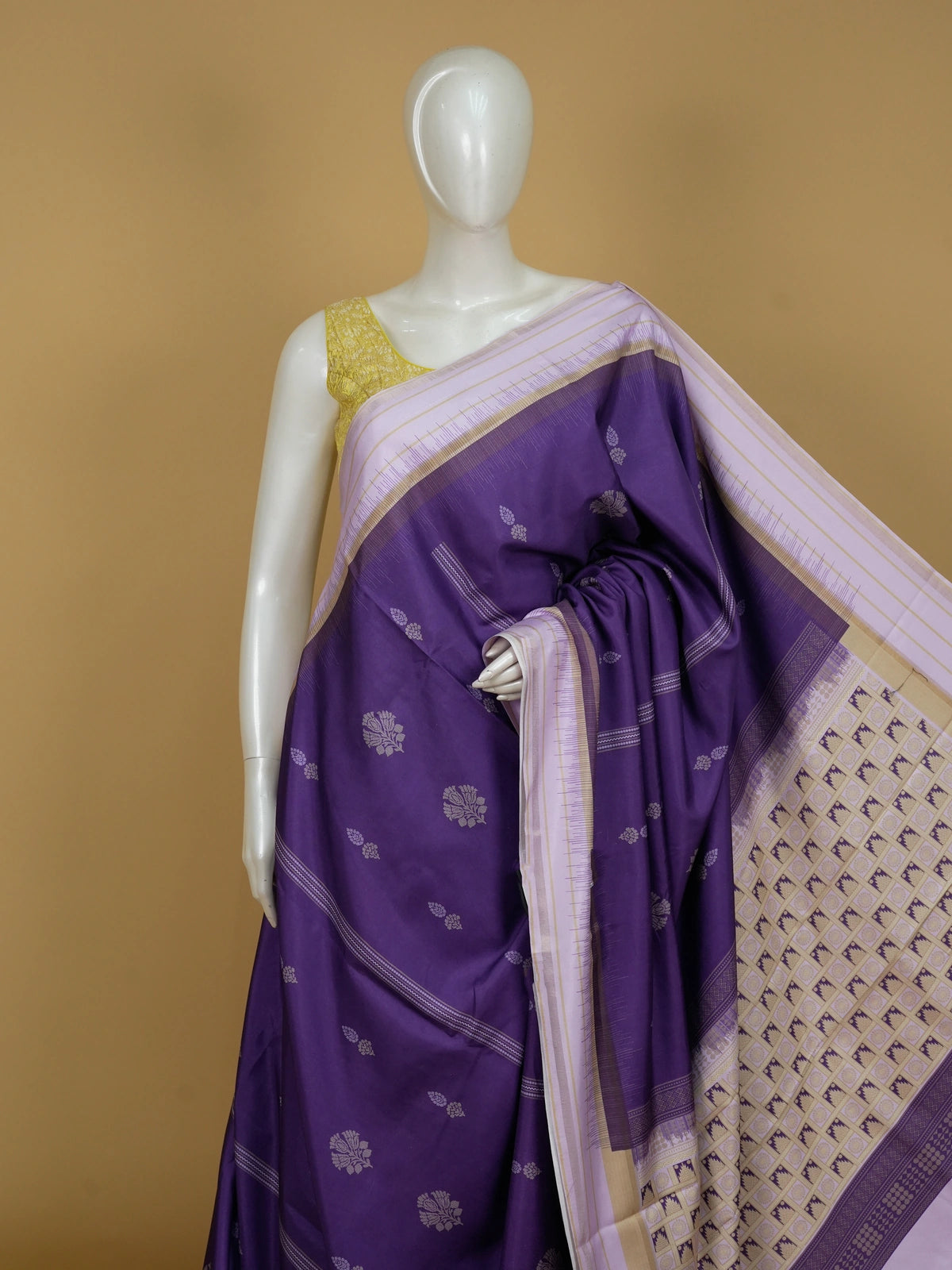Purple Dola silk saree with lavender contrast border, floral buttas, and patterned pallu