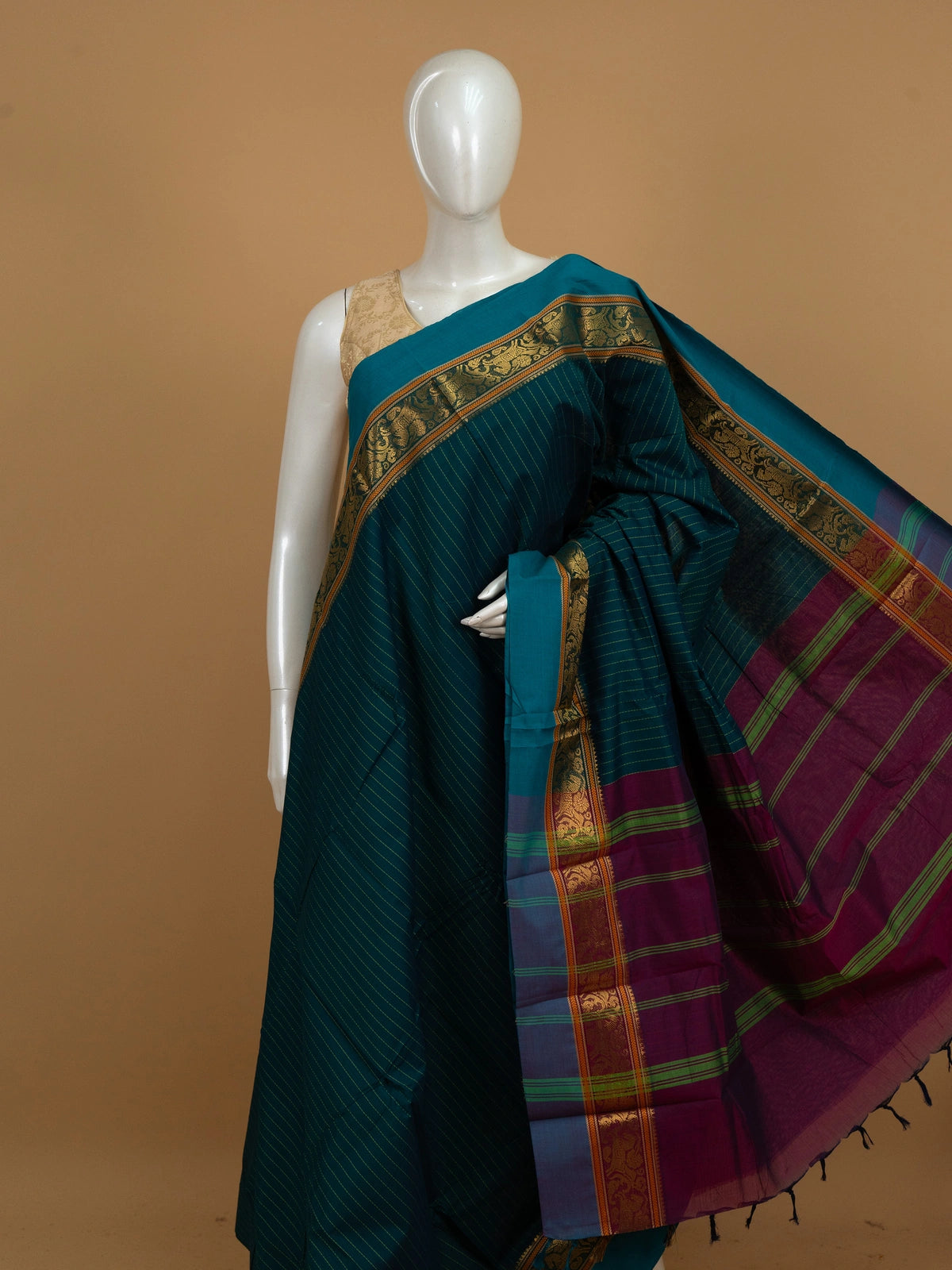 Teal blue Chettinad cotton saree with green pinstripes, gold zari border and contrast magenta pallu