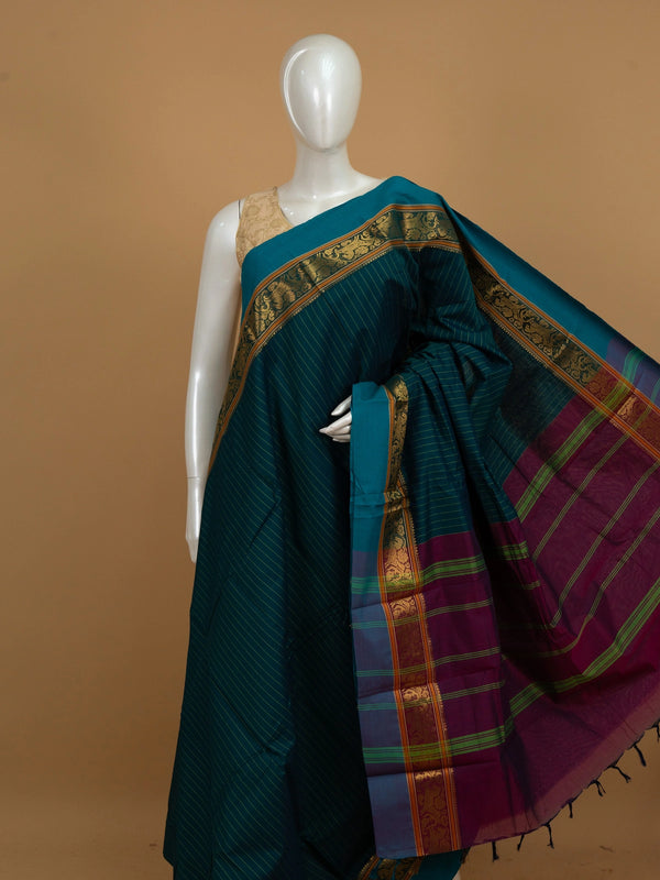 Teal blue Chettinad cotton saree with green pinstripes, gold zari border and contrast magenta pallu