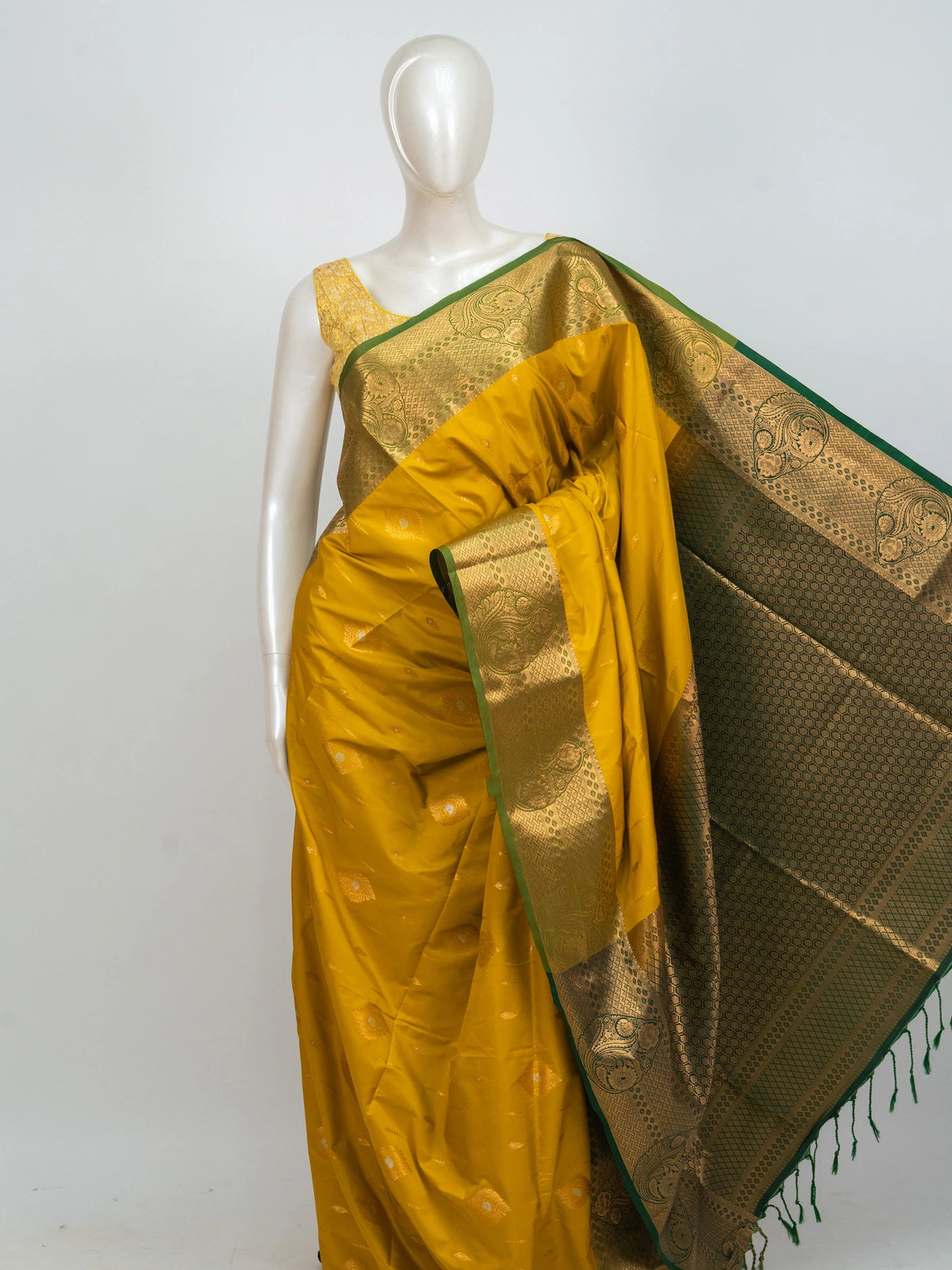 Mustard yellow Kanchipuram fancy silk saree with green contrast zari border and pallu