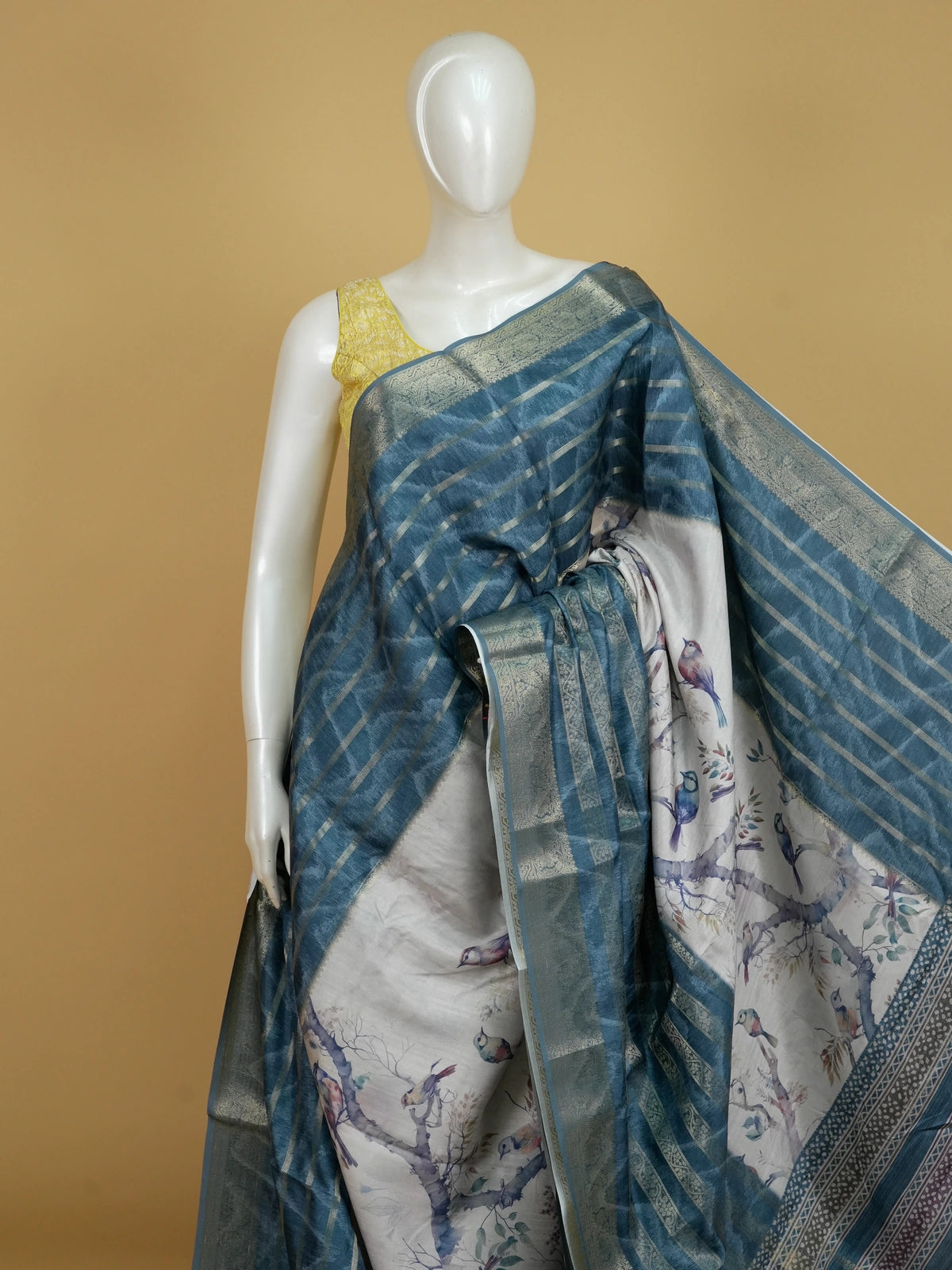 Teal blue and cream semi tussar saree with watercolour bird print and gold zari border