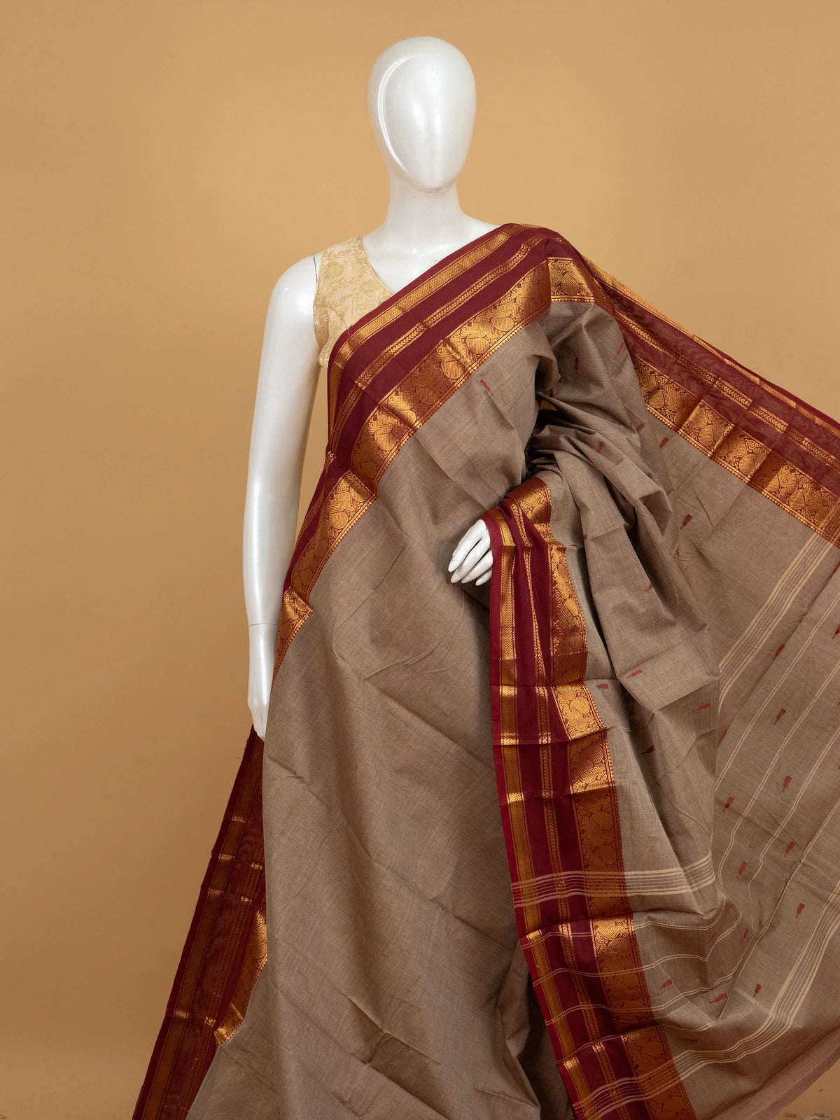 Taupe-grey Chettinad cotton saree with maroon and gold zari contrast border and red butta motifs