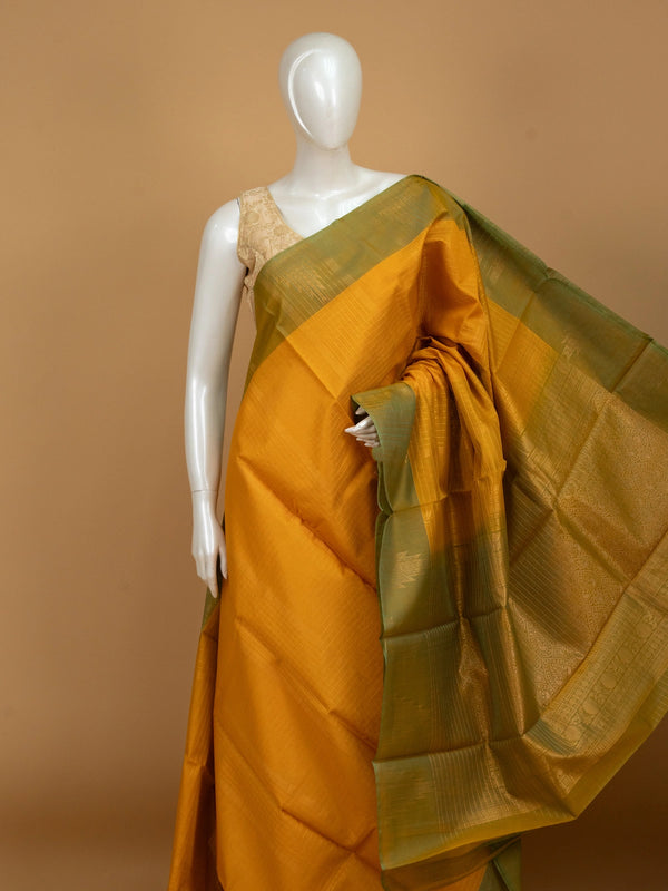 Mustard yellow pure silk cotton saree with olive green contrast zari border and golden pallu