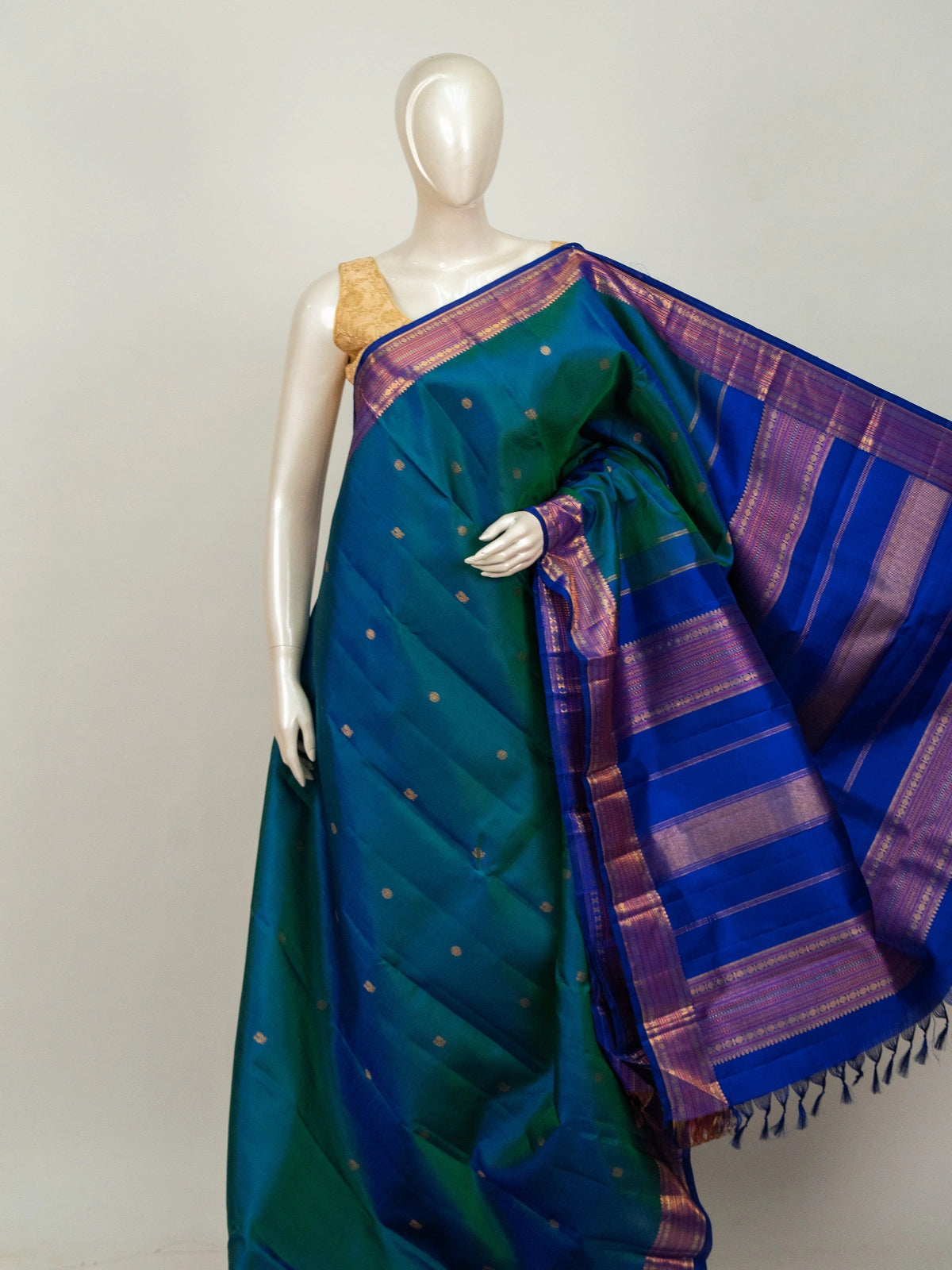 Peacock teal pure Kanchipuram silk saree with contrast royal blue gold zari border and woven pallu