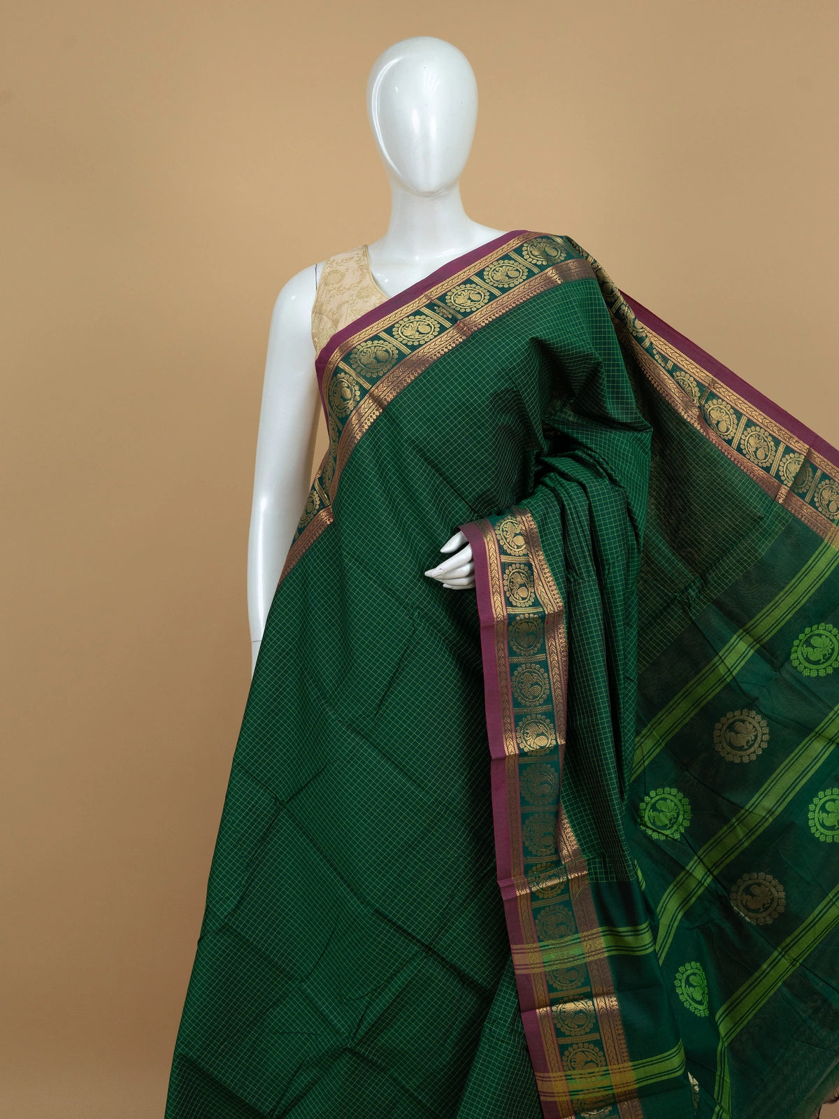 Green Chettinad cotton saree with yellow checks and a magenta gold zari peacock border