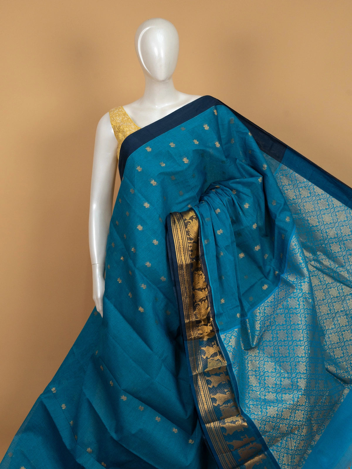 Peacock blue Chettinad cotton saree with gold zari lotus buttas and contrast navy figurative zari border