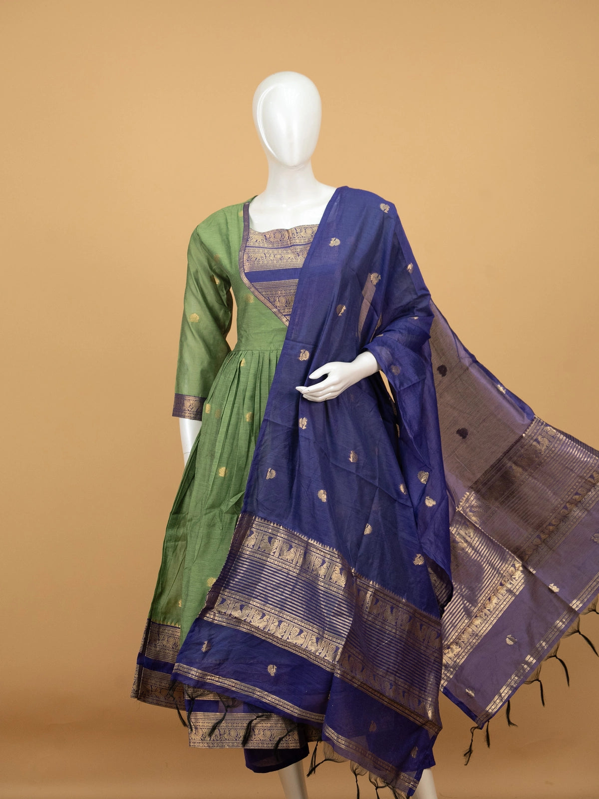 Green cotton silk Anarkali kurti set with navy zari woven yoke, elephant-motif border, and contrast navy dupatta