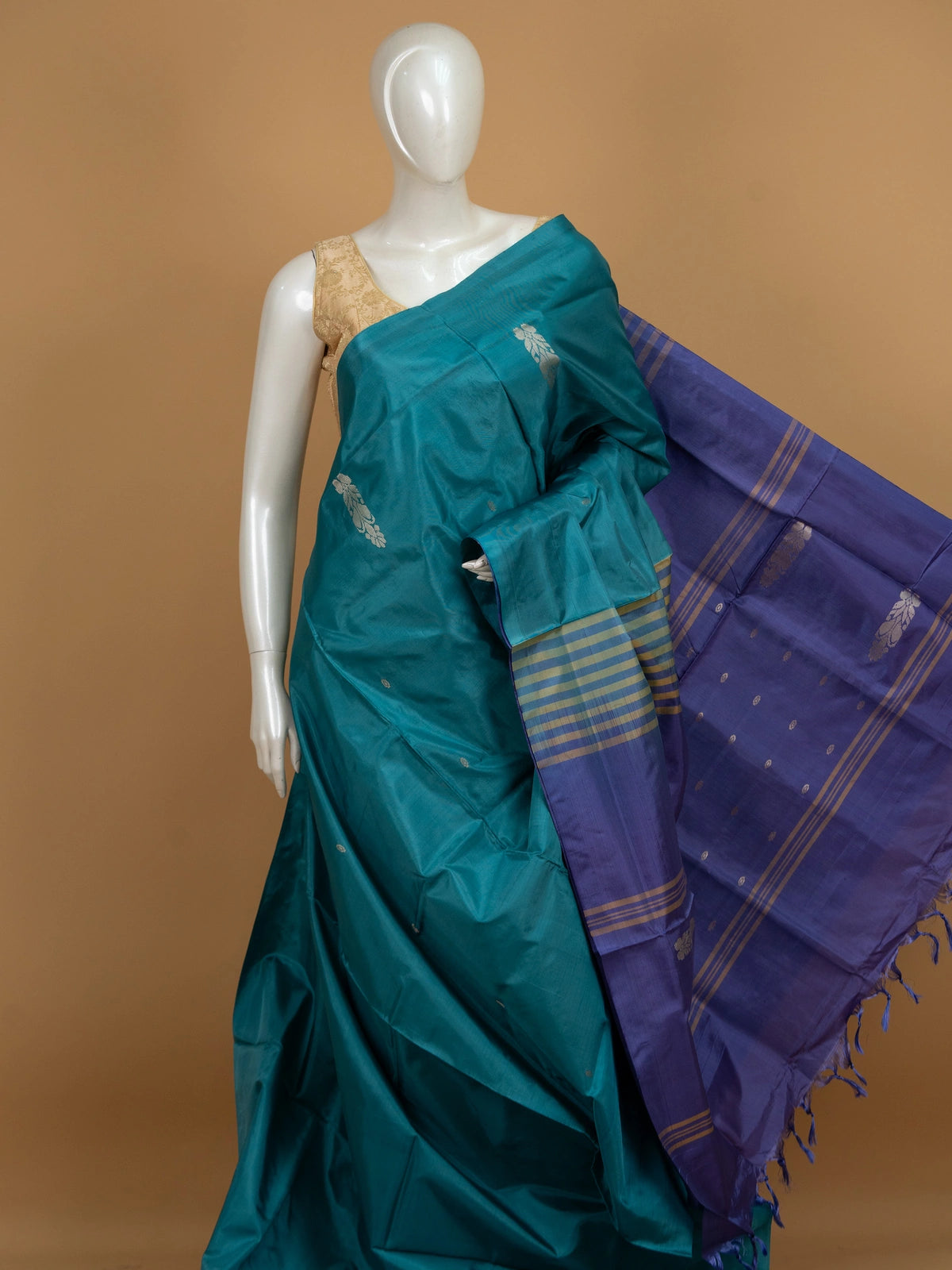 Teal blue banana silk saree with contrast purple pallu and gold zari border