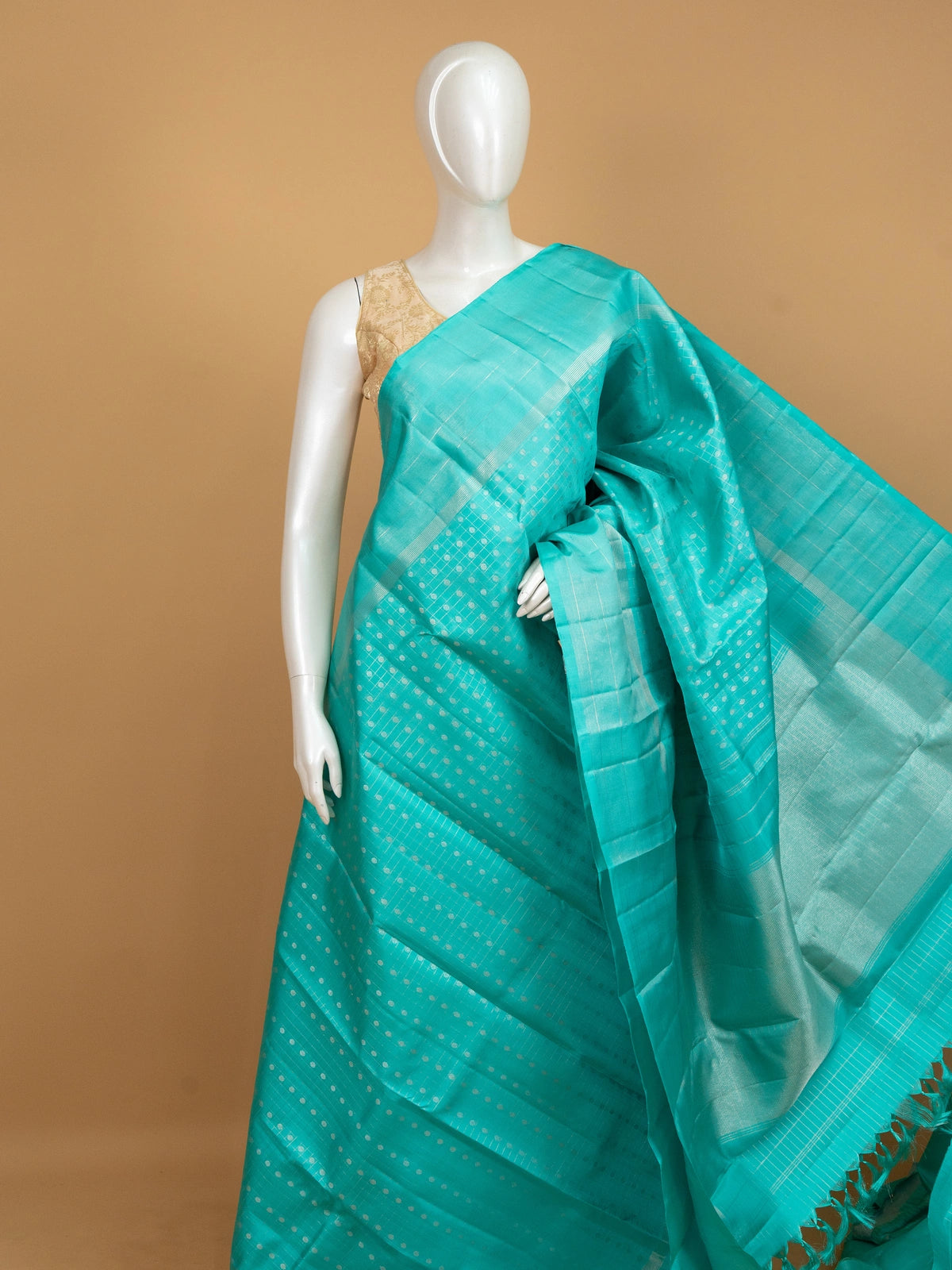 Turquoise blue pure Kanchipuram silk saree with silver zari checks, buti motifs and striped zari border