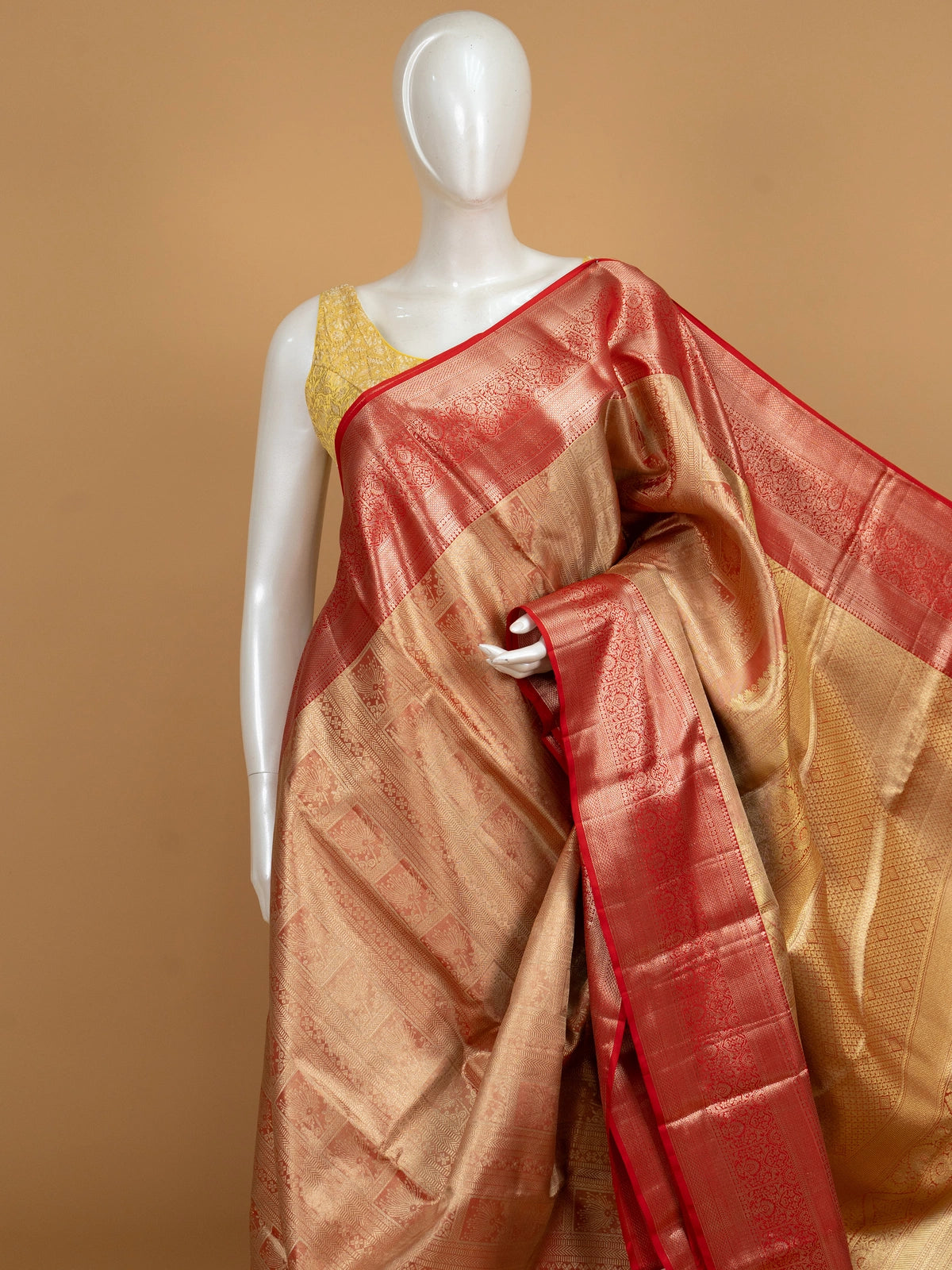 Gold and red pure Kanchipuram silk saree with gold zari brocade body and contrast red border
