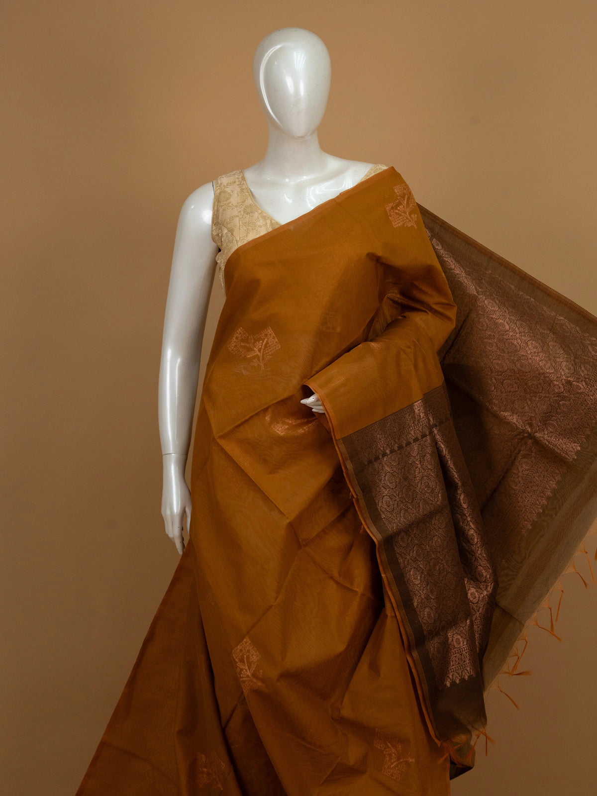 Mustard silk cotton saree with contrast dark brown copper zari border and woven buttas